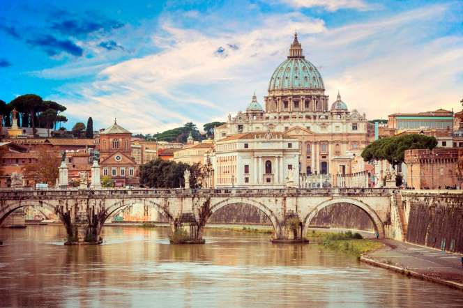 View of the Tiber River and St. Peter's Basilica in Rome Italy